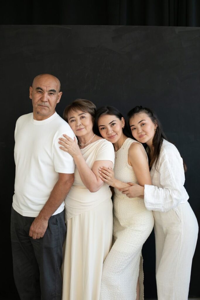 A multi-generational family portrait indoors with a warm and close bond.